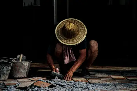 Tile installer setting tile during a flooring project