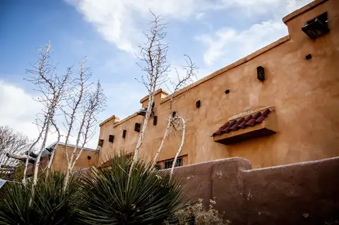 Adobe-style architecture under a clear sky near Espanola, New Mexico